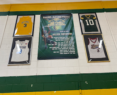 In honor of his achievements at Bethel, Allen’s two high school jersey numbers have been retired.