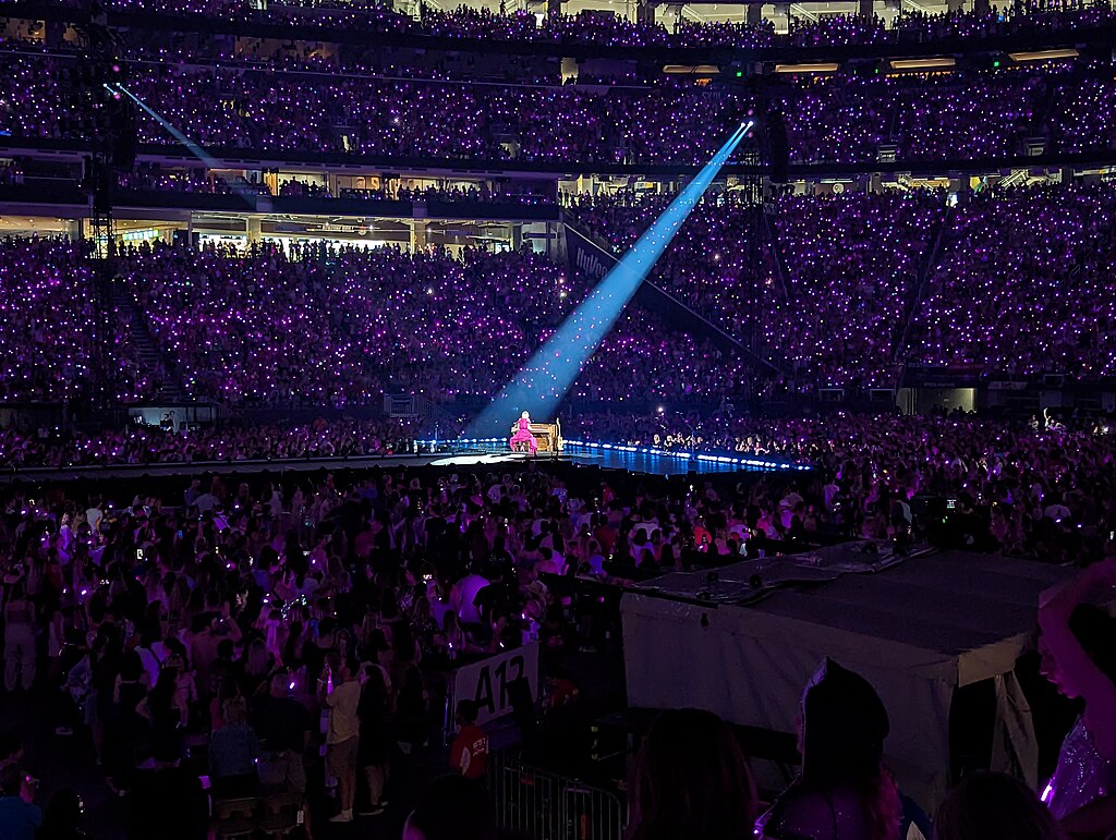 Image of Taylor Swift performing in Minneapolis for the Eras Tour. Photo credit © Michael Hicks, CC BY 2.0 , via Wikimedia Commons