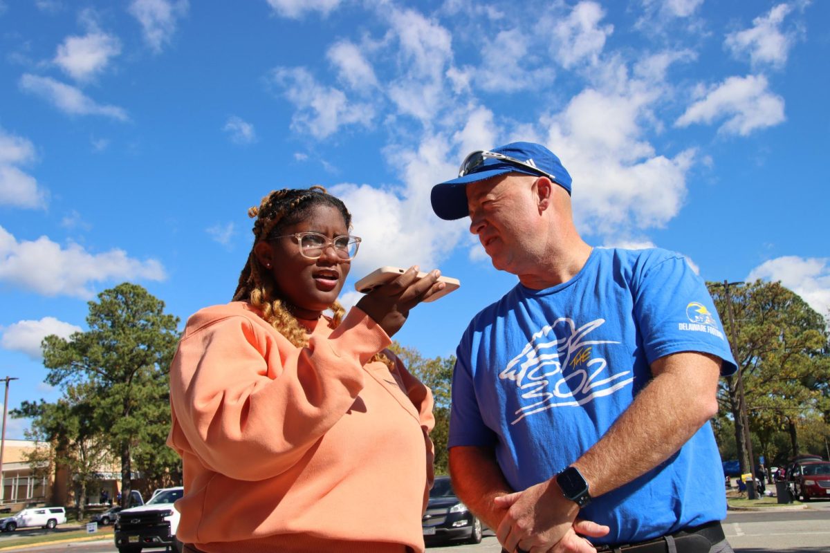 Editor Krystal Jones conducts interviews outside Armstrong Stadium. 