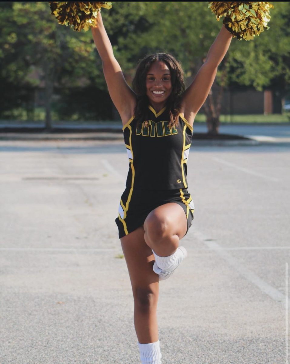 Brooklynn Roberts is another co-captain and senior on the Bethel Cheer squad. She wanted to become a cheerleader because of their upbeat and joyful spirit. “I saw the joy that everyone had when the cheerleaders were around,” Brooklyn said. “That was something I wanted to be a part of.” She also works at Smokey Bones alongside Jehdeiah, and she thinks that having balance plays a big role in how to manage time as a cheerleader.