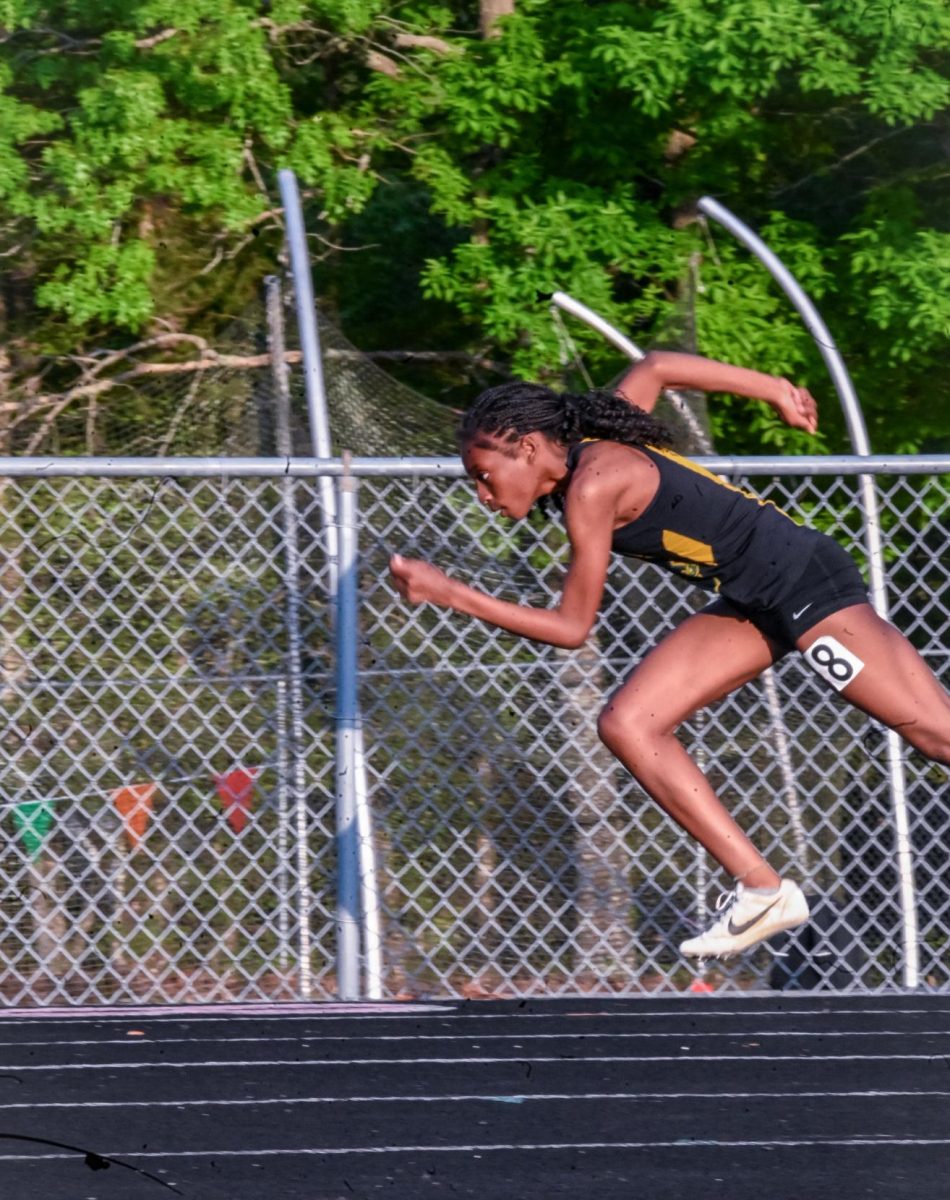 Sophomore Taylor Shelby taking off during her 200 meter race.