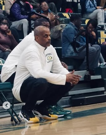 Coach Brehon in deep thought on the sideline as he looks on the game.